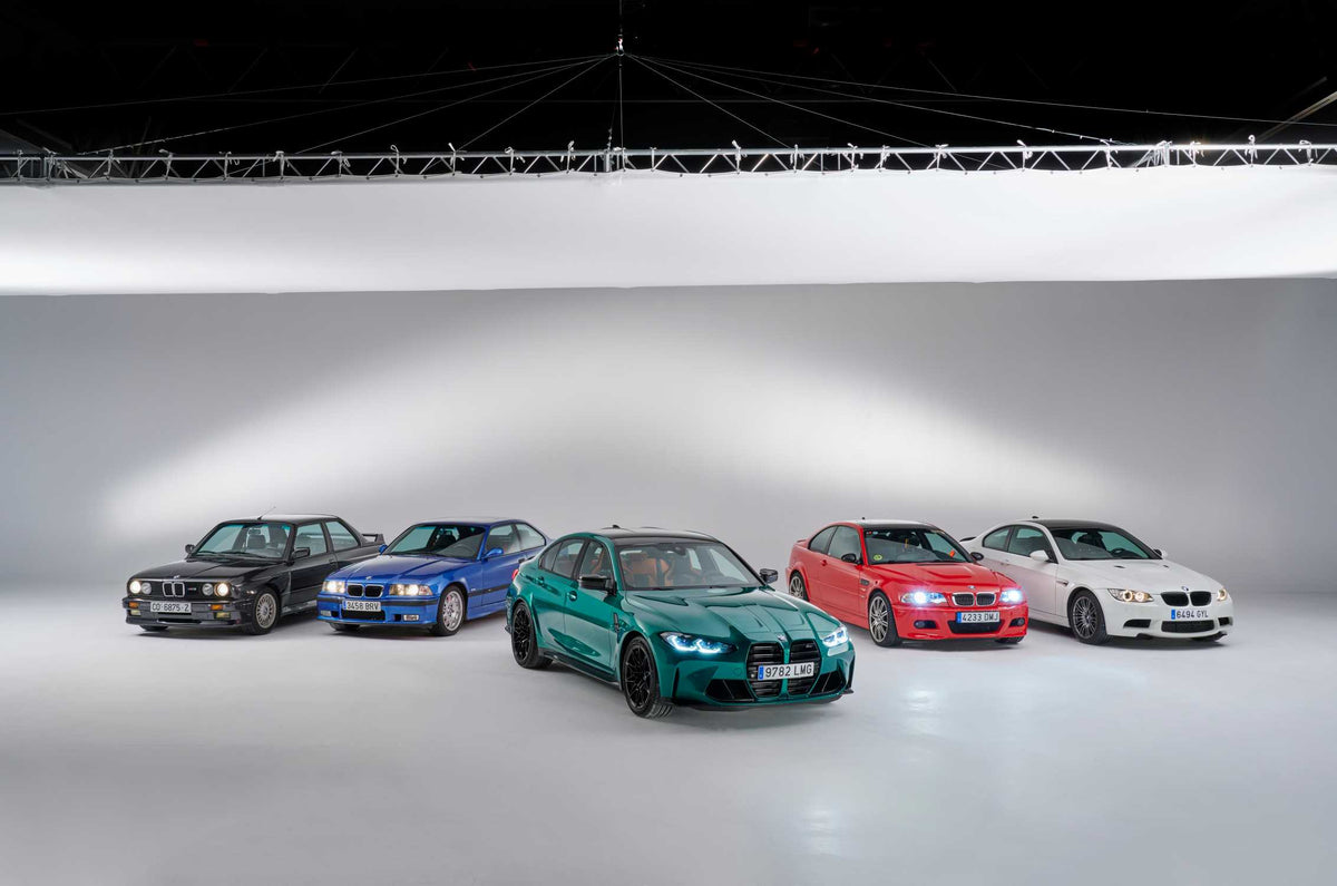 Five generations of BMW M3 arranged in an official BMW studio photograph