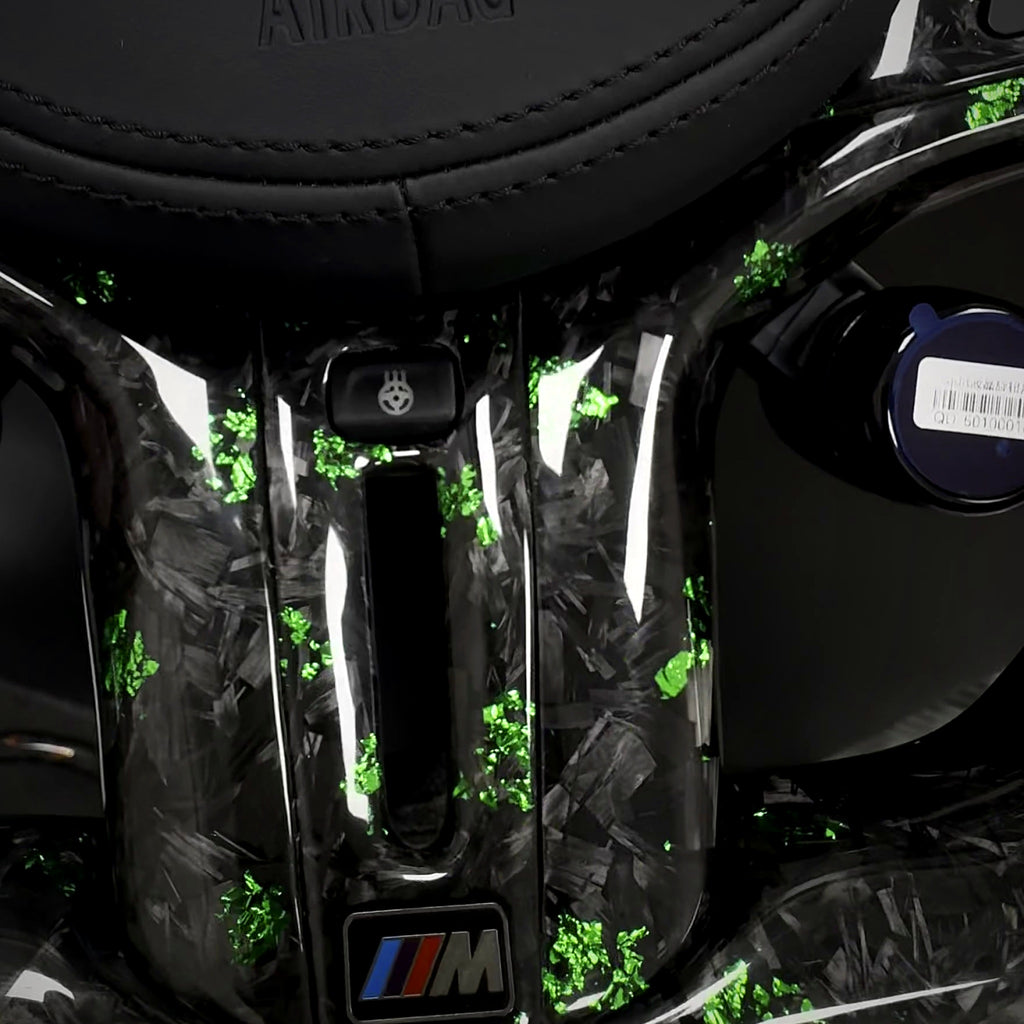 Forged carbon lower spoke with green flakes and M badge