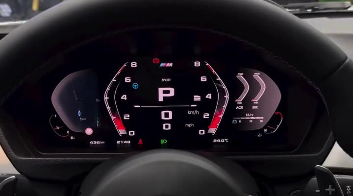 Actual BMW digital dash M-style layout with large gear indicator, speed, rev counter and navigation widget
