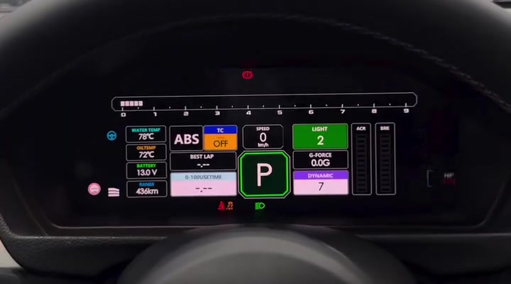 Actual digital instrument cluster Race Grid screen with shift-light bar, oil and water temperatures, battery voltage and G-force