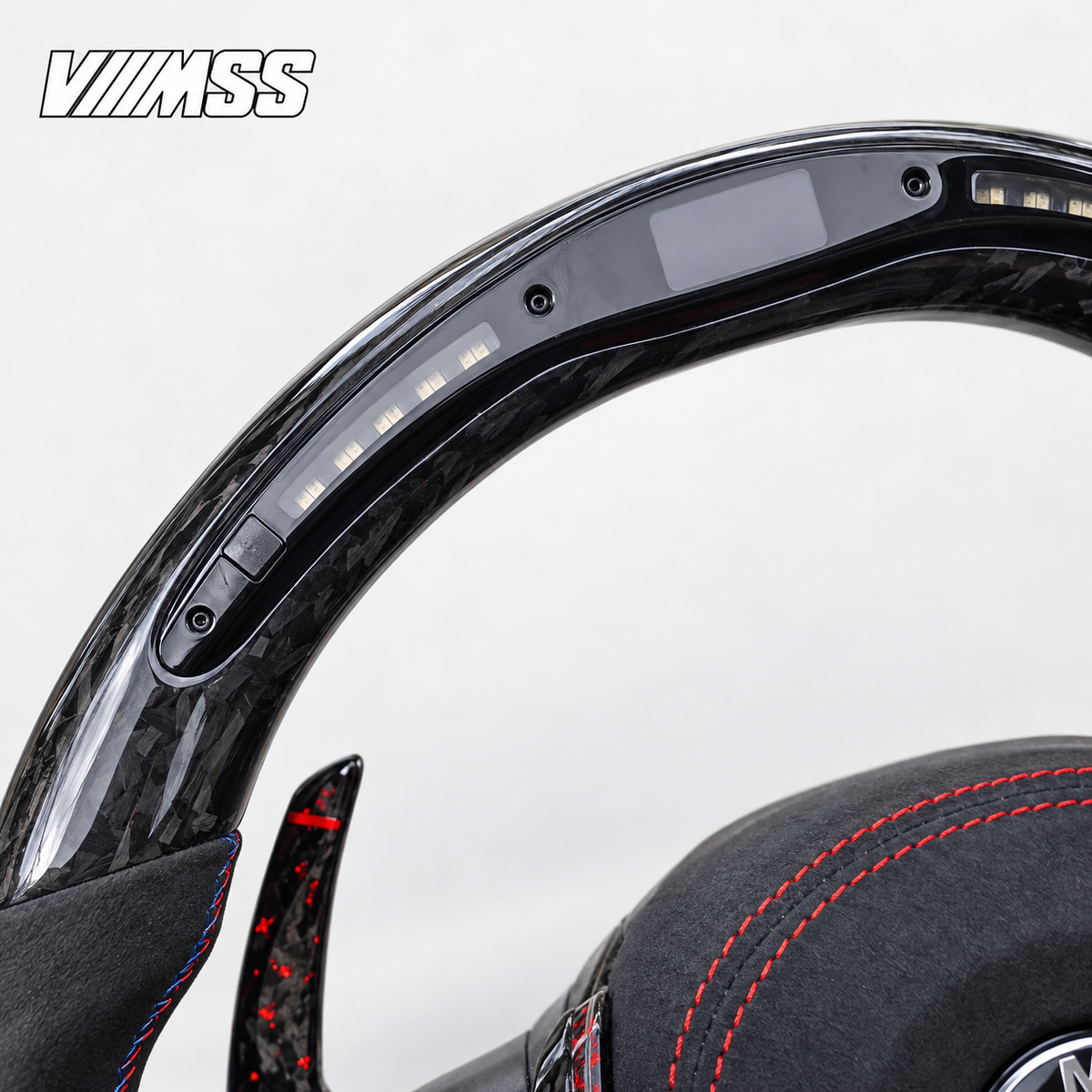 BMW F-Series Forged Carbon & Alcantara LED Steering Wheel — Upper rim and 12 o’clock detail; VMSS studio close-up