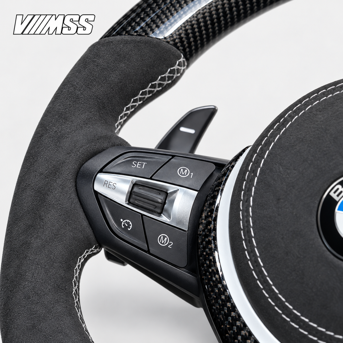 BMW F-Series White-Stripe Carbon Fibre & Alcantara Steering Wheel — Buttons and visible paddle detail; VMSS studio close-up