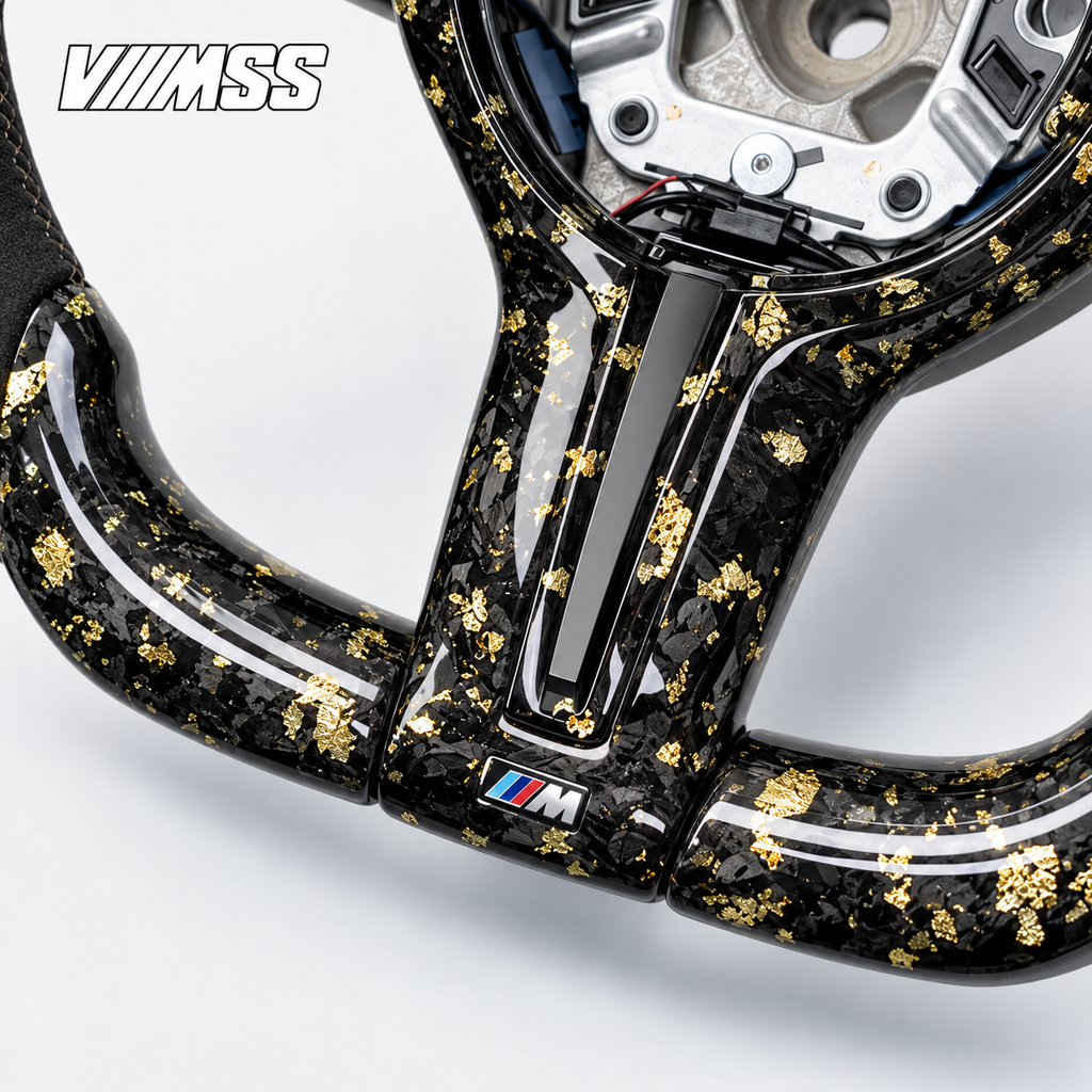 BMW F-Series Gold-Flake Forged Carbon & Alcantara LED Steering Wheel — Centre trim and lower rim detail; VMSS studio close-up