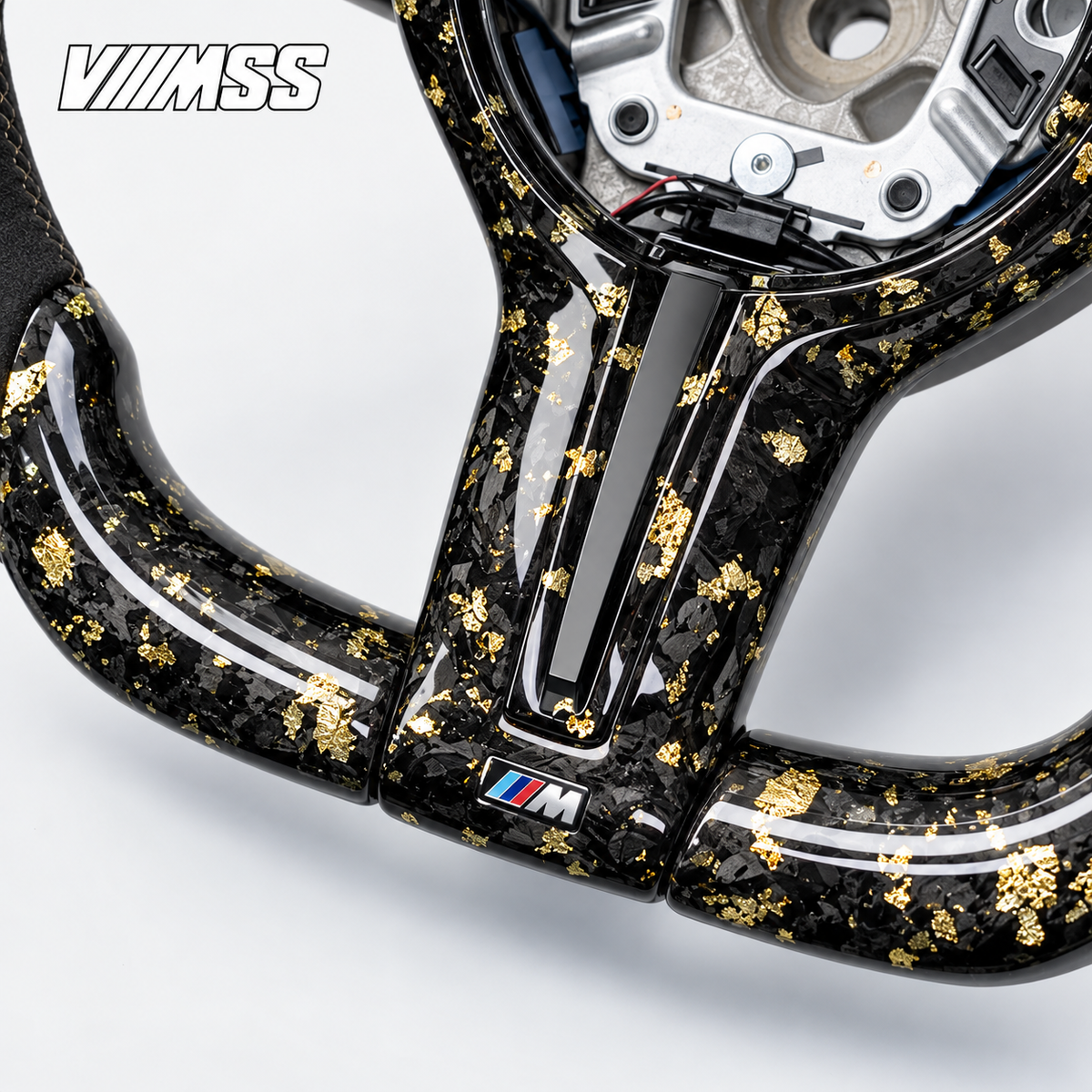 BMW F-Series Gold-Flake Forged Carbon & Alcantara LED Steering Wheel — Centre trim and lower rim detail; VMSS studio close-up