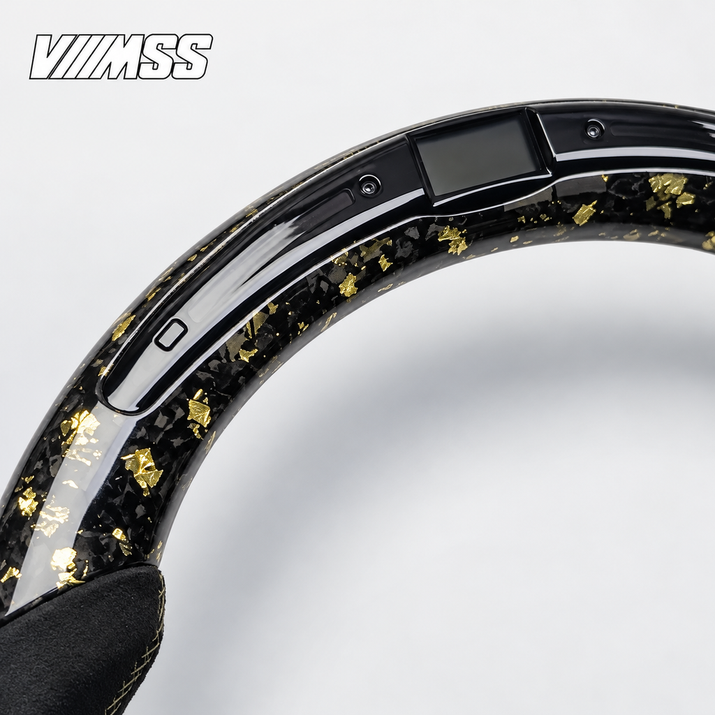 BMW F-Series Gold-Flake Forged Carbon & Alcantara LED Steering Wheel — Upper rim and 12 o’clock detail; VMSS studio close-up
