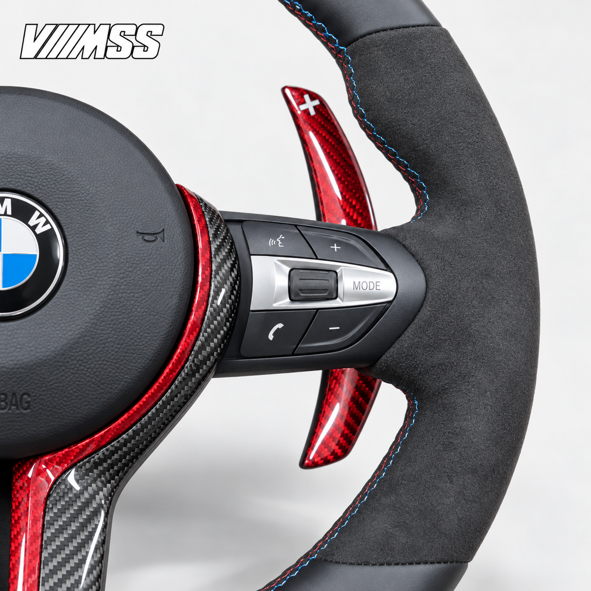 BMW F-Series Red-Stripe Leather & Alcantara — Carbon Trim Steering Wheel — Grip, stitching and right control detail; VMSS studio close-up
