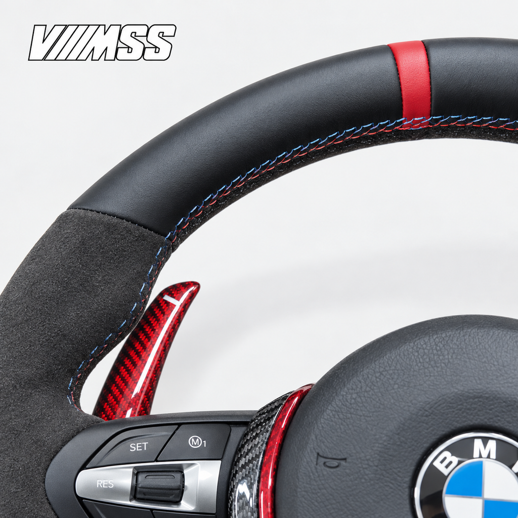 BMW F-Series Red-Stripe Leather & Alcantara — Carbon Trim Steering Wheel — Upper rim and 12 o’clock detail; VMSS studio close-up