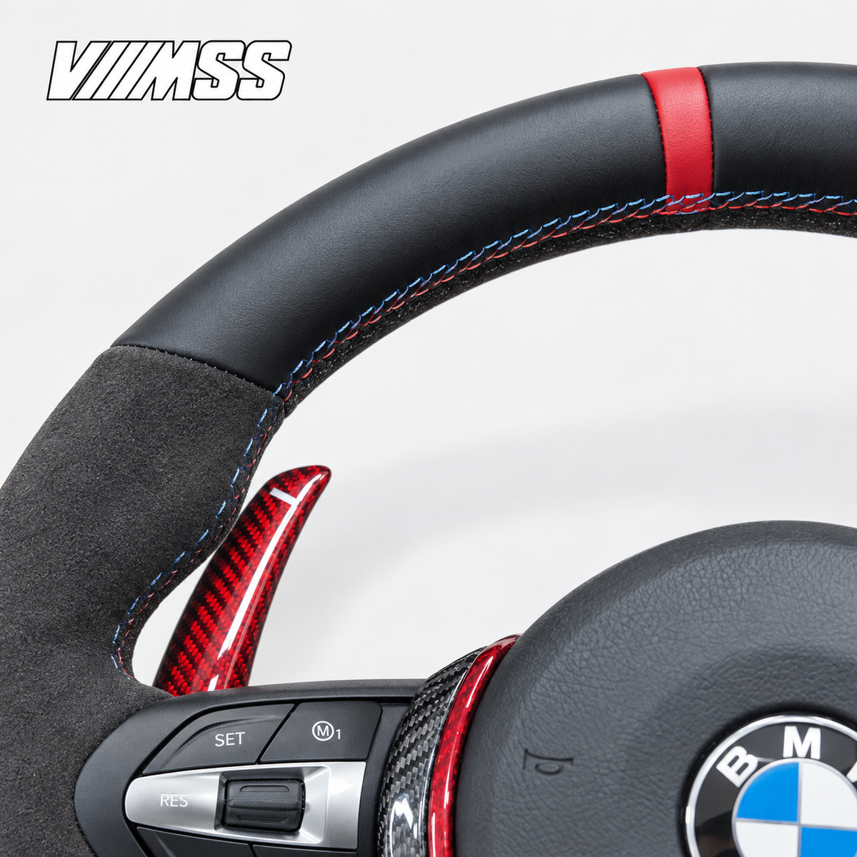 BMW F-Series Red-Stripe Leather & Alcantara — Carbon Trim Steering Wheel — Upper rim and 12 o’clock detail; VMSS studio close-up