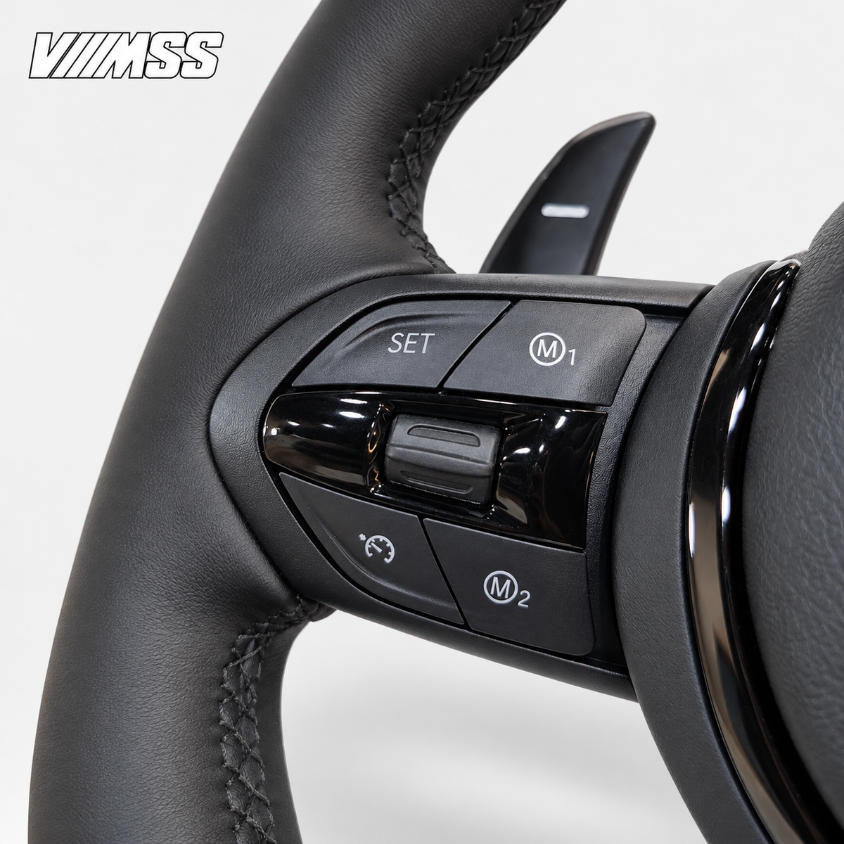 BMW F-Series Nappa Leather Sport — Black Trim Steering Wheel — Buttons and visible paddle detail; VMSS studio close-up