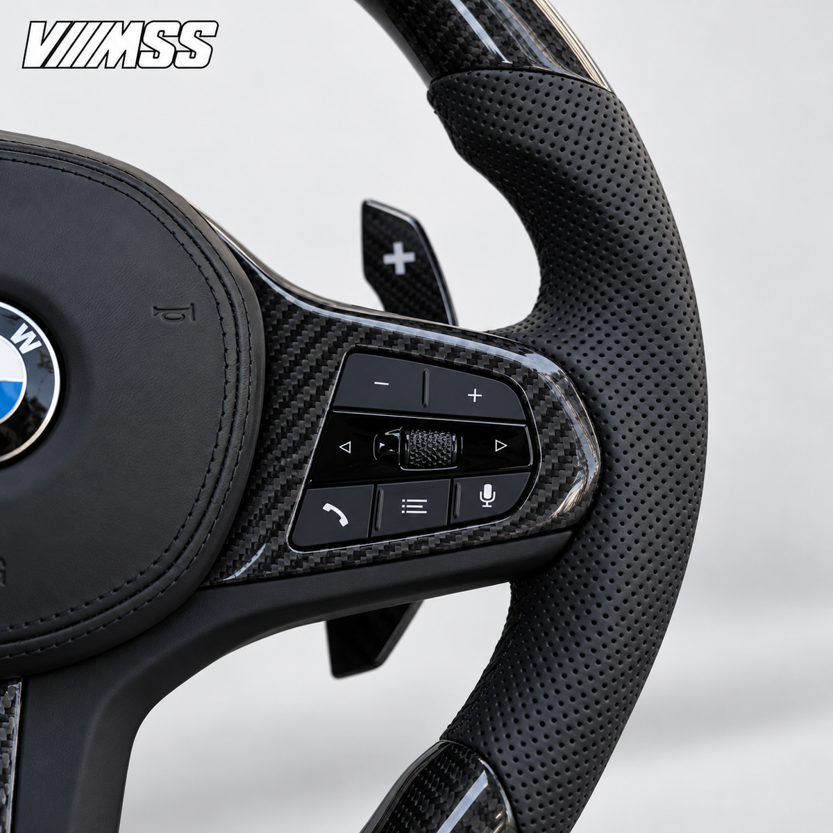 BMW G-Series Carbon Fibre & Perforated Leather Steering Wheel — Grip, stitching and right control detail; VMSS studio close-up