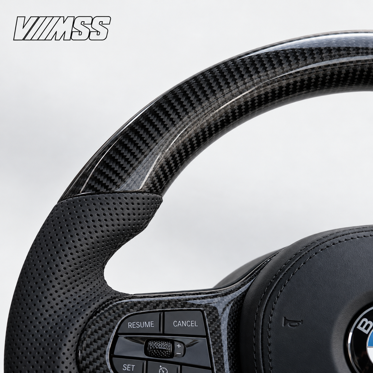 BMW G-Series Carbon Fibre & Perforated Leather Steering Wheel — Upper rim and 12 o’clock detail; VMSS studio close-up