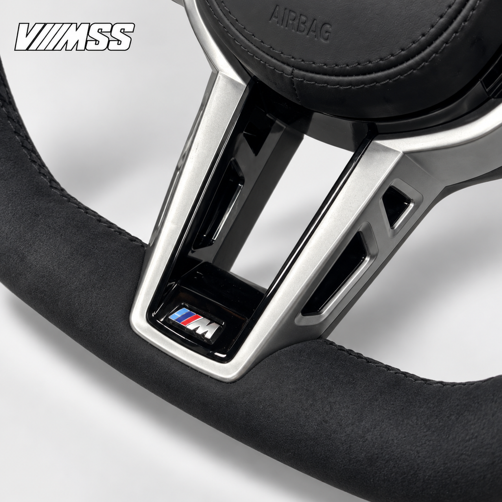 BMW G-Series CS-Inspired Alcantara — Black Trim Steering Wheel — Centre trim and lower rim detail; VMSS studio close-up