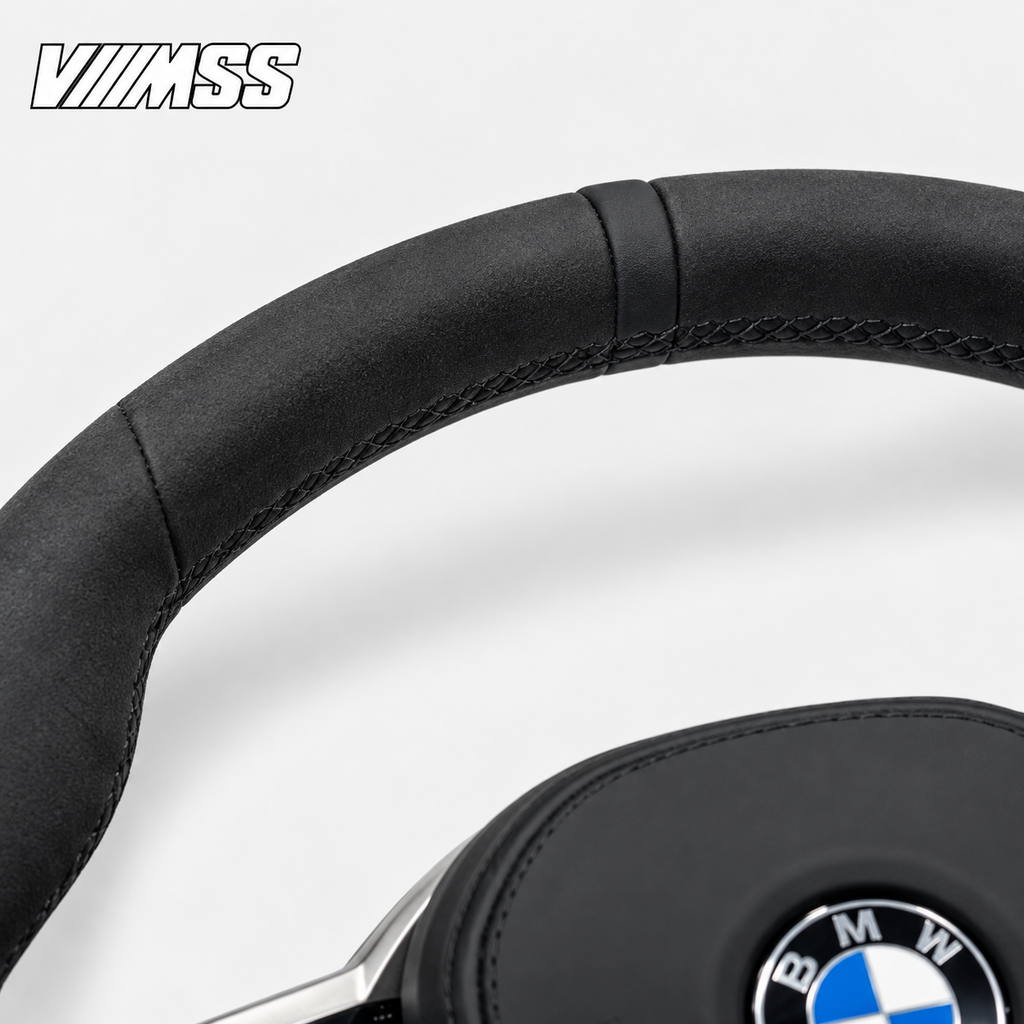 BMW G-Series CS-Inspired Alcantara — Black Trim Steering Wheel — Upper rim and 12 o’clock detail; VMSS studio close-up
