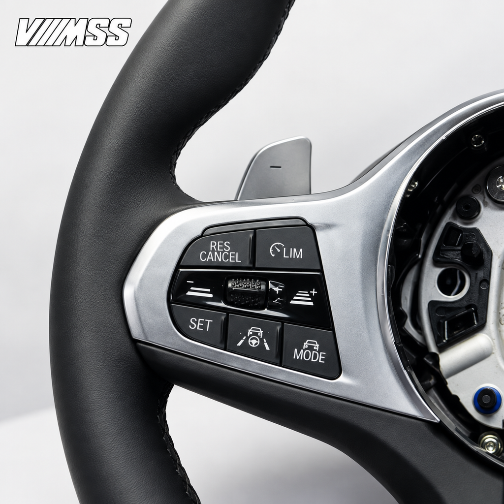 BMW G-Series Nappa Leather Sport — Silver Trim Steering Wheel — Buttons and visible paddle detail; VMSS studio close-up