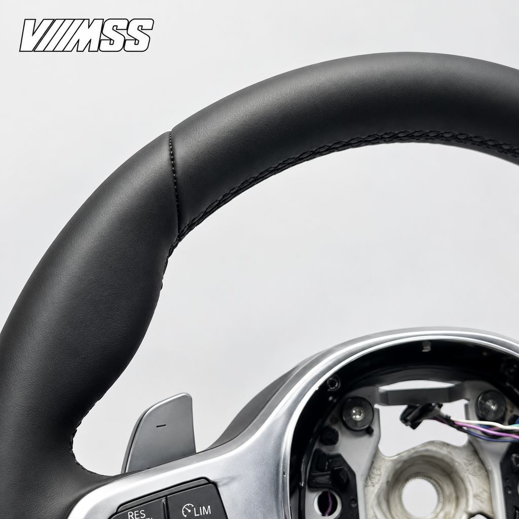 BMW G-Series Nappa Leather Sport — Silver Trim Steering Wheel — Upper rim and 12 o’clock detail; VMSS studio close-up