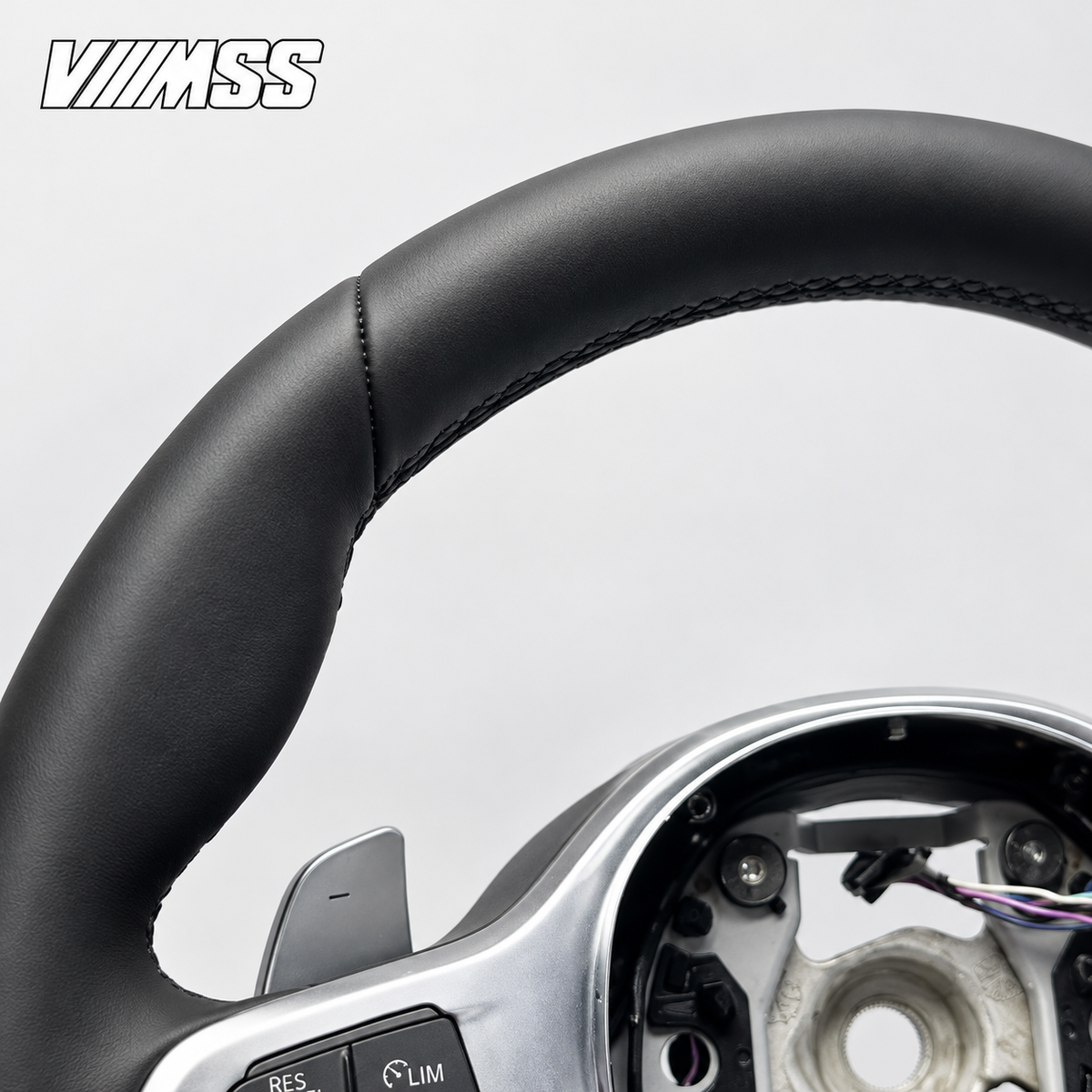 BMW G-Series Nappa Leather Sport — Silver Trim Steering Wheel — Upper rim and 12 o’clock detail; VMSS studio close-up