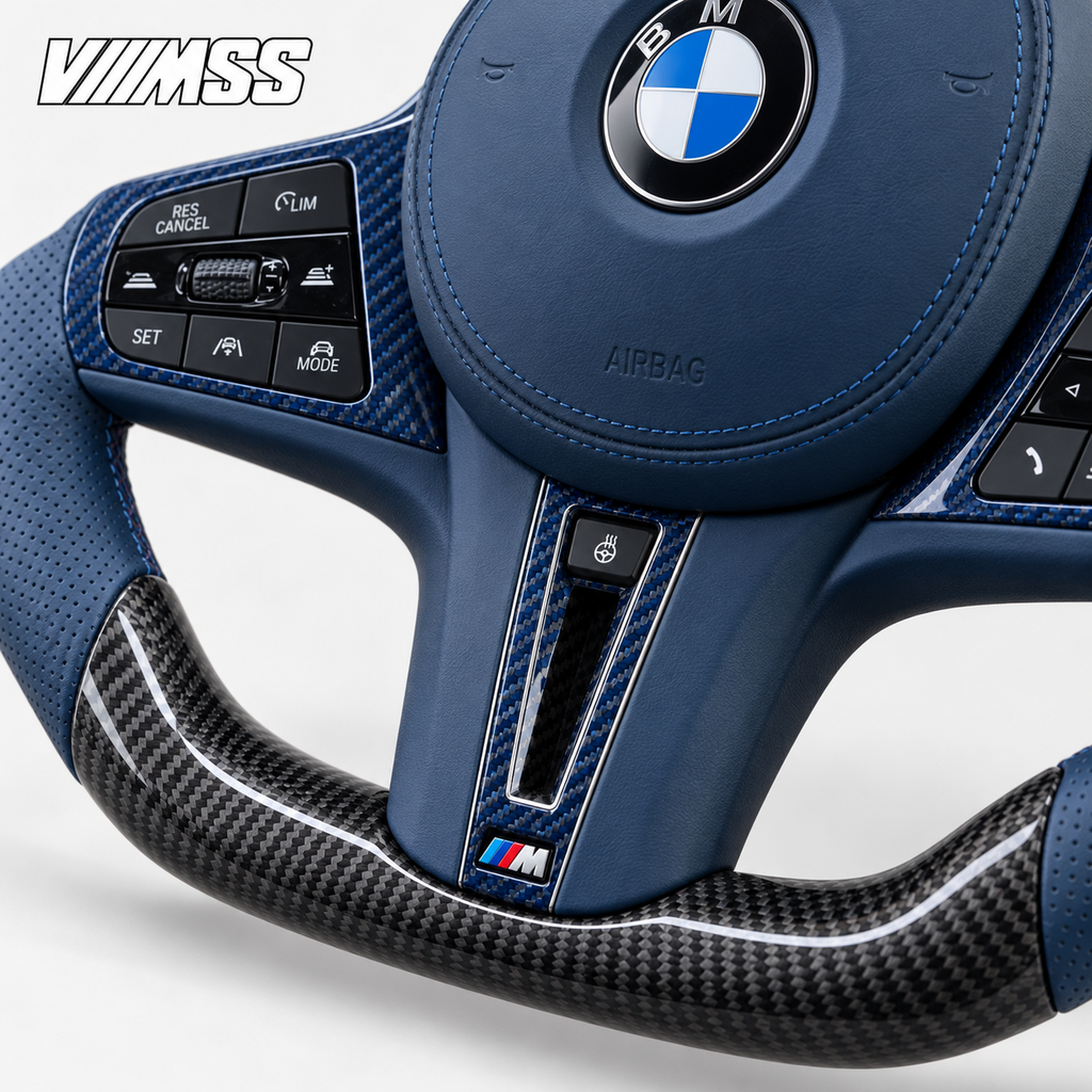 BMW G-Series Blue Leather & Carbon Fibre LED Steering Wheel — Centre trim and lower rim detail; VMSS studio close-up
