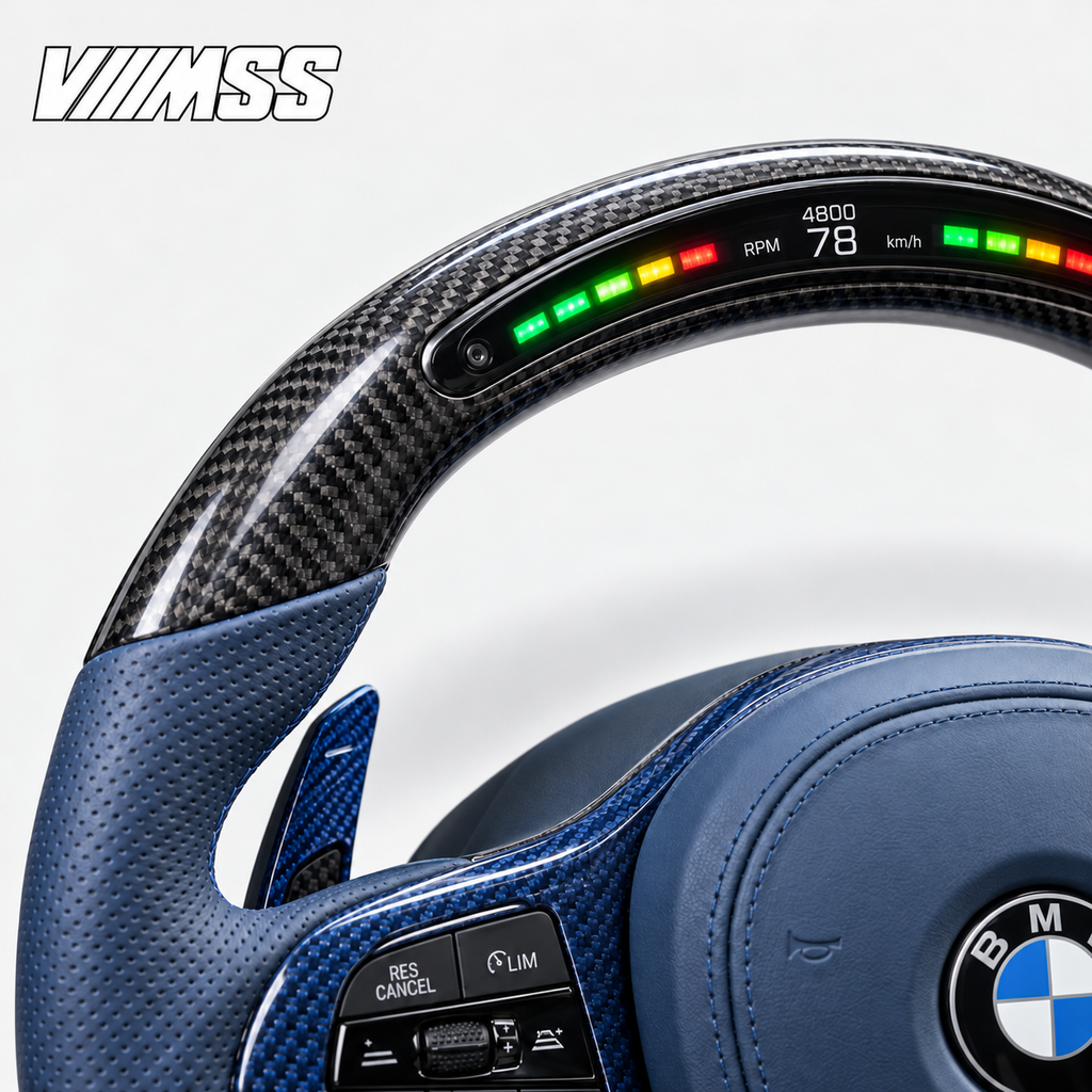 BMW G-Series Blue Leather & Carbon Fibre LED Steering Wheel — Upper rim and 12 o’clock detail; VMSS studio close-up