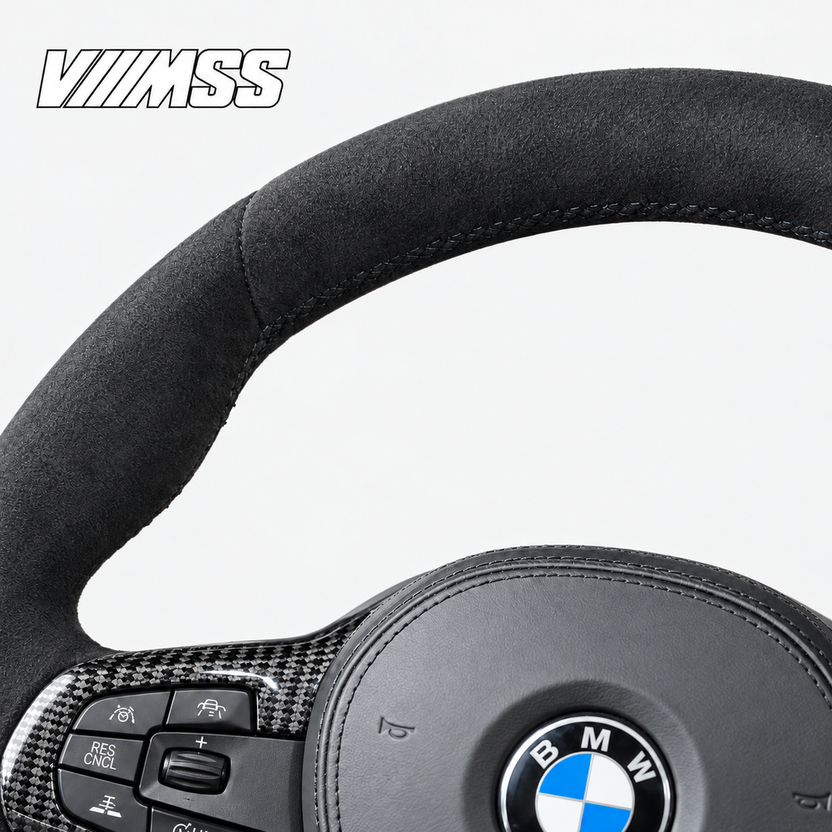 BMW G-Series Full Alcantara — Carbon Trim Steering Wheel — Upper rim and 12 o’clock detail; VMSS studio close-up
